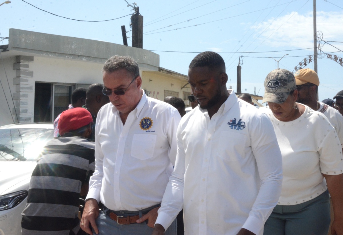 Minister of Science, Energy, Telecommunications and Transport (MSETT), Hon. Daryl Vaz (left) and Mayor of Montego Bay, Councillor Richard Vernon (right), tour the Montego Bay Transport Centre and land owned by the Jamaica Railway Corporation (JRC) in the city, on Thursday (August 22).

