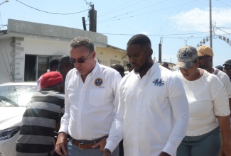 Minister of Science, Energy, Telecommunications and Transport (MSETT), Hon. Daryl Vaz (left) and Mayor of Montego Bay, Councillor Richard Vernon (right), tour the Montego Bay Transport Centre and land owned by the Jamaica Railway Corporation (JRC) in the city, on Thursday (August 22).

