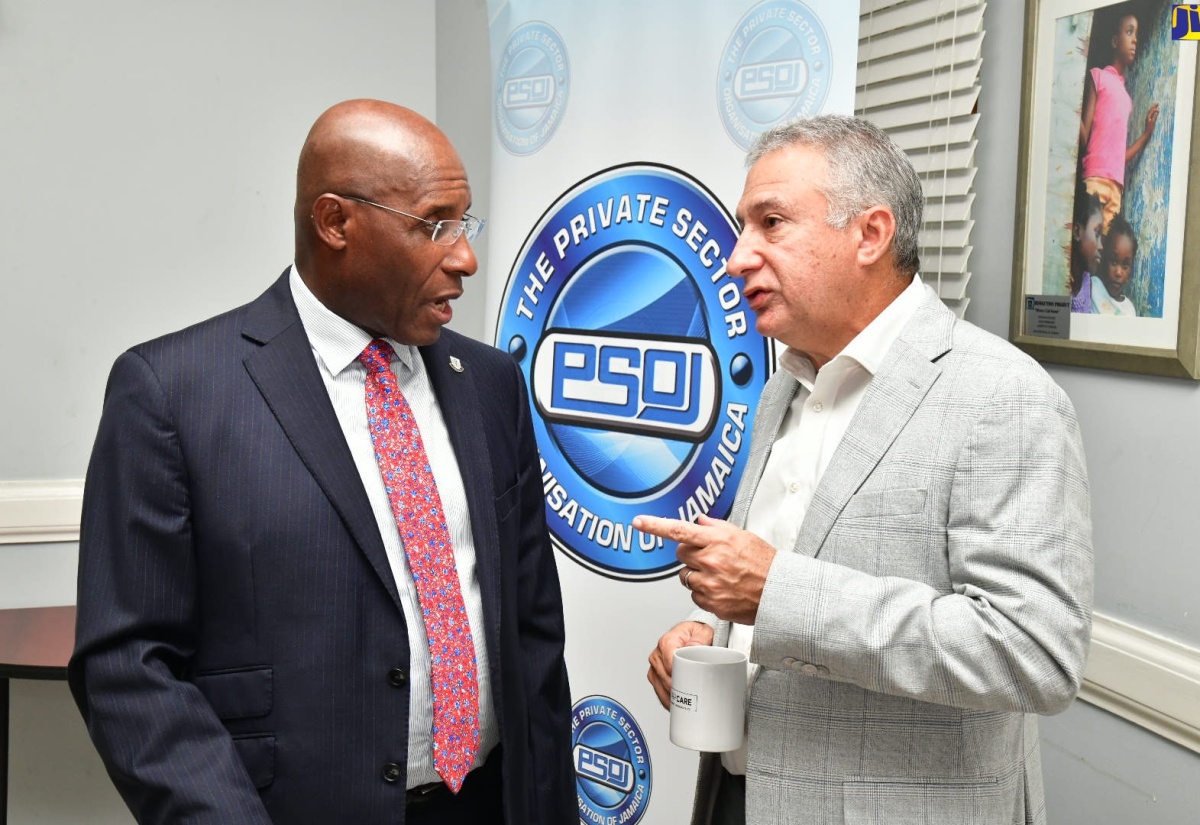 Minister of Industry, Investment and Commerce, Senator the Hon. Aubyn Hill (left), in discussion with Private Sector Organisation of Jamaica (PSOJ) President, Metry Seaga, during the PSOJ Partners’ Circle Meeting on Friday (August 23). The meeting was held at the PSOJ’s head office in Kingston.

