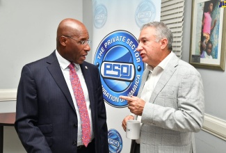 Minister of Industry, Investment and Commerce, Senator the Hon. Aubyn Hill (left), in discussion with Private Sector Organisation of Jamaica (PSOJ) President, Metry Seaga, during the PSOJ Partners’ Circle Meeting on Friday (August 23). The meeting was held at the PSOJ’s head office in Kingston.

