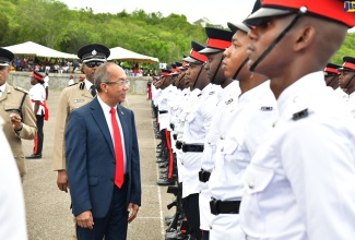 National Security Minister, Hon. Dr. Horace Chang, inspects new Jamaica Constabulary Force (JCF) constables during the passing out parade and awards ceremony for 129 new members, at the National Police College of Jamaica in St. Catherine, on August 28.

