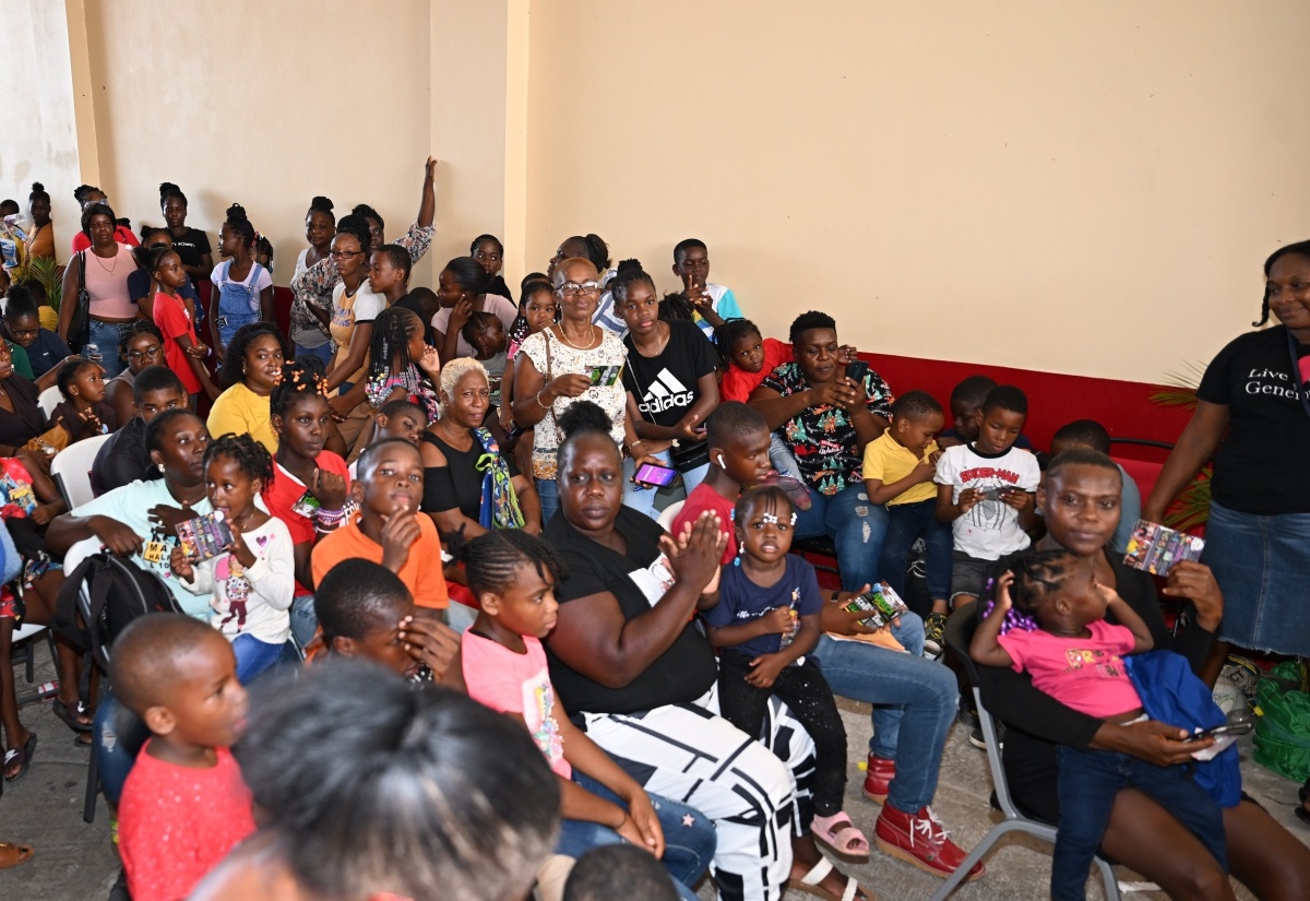 Parents and children gather at the Black River Fire Station in St. Elizabeth on August 9 for a back-to-school fair organised by Jamaicans in the United States.