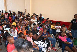 Parents and children gather at the Black River Fire Station in St. Elizabeth on August 9 for a back-to-school fair organised by Jamaicans in the United States.