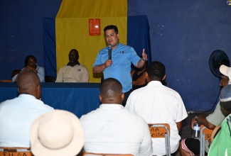 Minister without Portfolio in the Ministry of Economic Growth & Job Creation, Senator the Hon. Matthew Samuda, addresses a community meeting in Jackson Town, Trelawny, on August 19.

