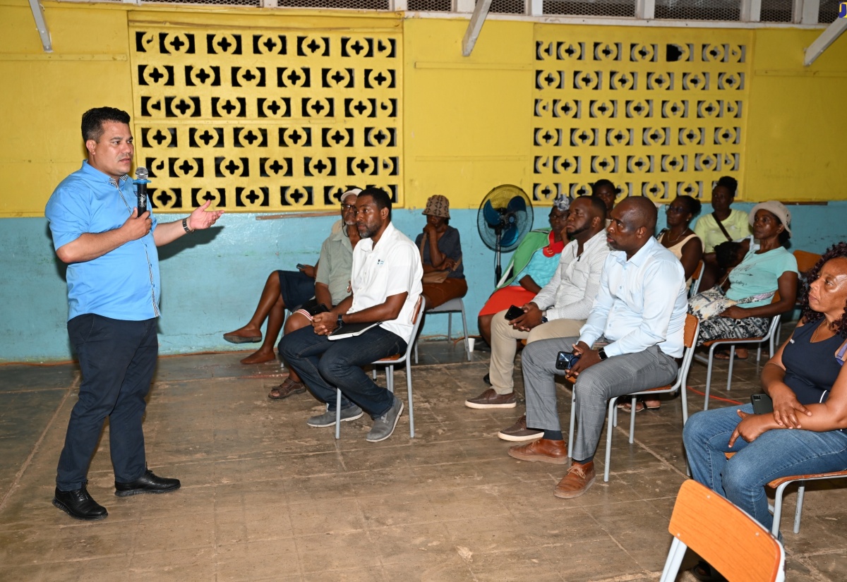 Minister without Portfolio in the Ministry of Economic Growth and Job Creation, Senator the Hon. Matthew Samuda, addresses a community meeting in Jackson Town, Trelawny, on Monday (August 19).

