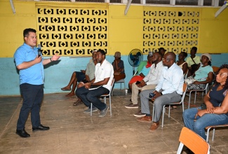 Minister without Portfolio in the Ministry of Economic Growth and Job Creation, Senator the Hon. Matthew Samuda, addresses a community meeting in Jackson Town, Trelawny, on Monday (August 19).

