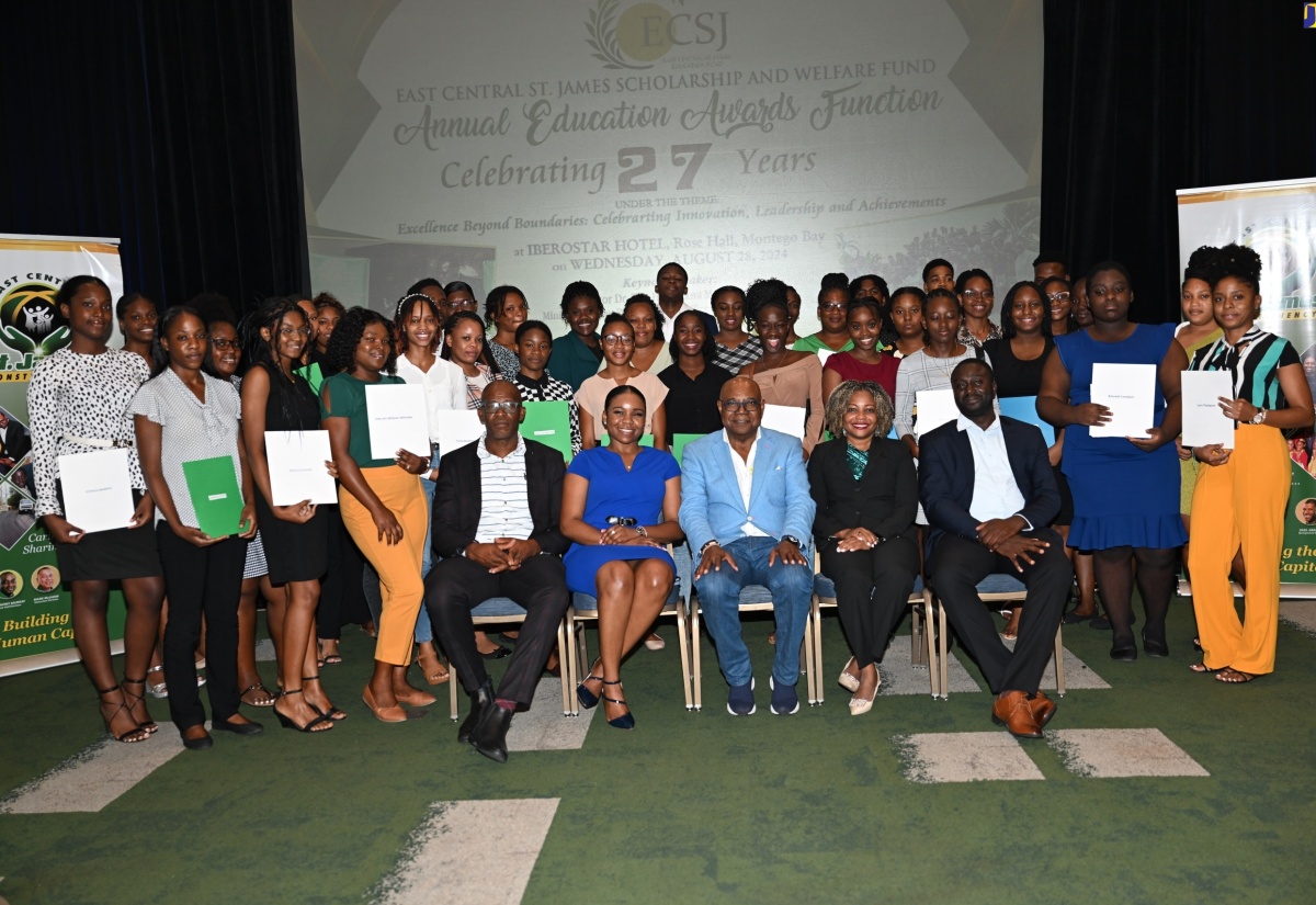 Minister without Portfolio in the Office of the Prime Minister with Responsibility for Information, Skills and Digital Transformation, Senator Dr. the Hon. Dana Morris Dixon (second right, seated), and Tourism Minister and Member of Parliament for St. James East Central, Hon. Edmund Bartlett (centre, seated), with this year’s beneficiaries of the East Central St. James Scholarship and Welfare Fund education awards. The occasion was the awards ceremony at the Iberostar Hotel in St. James on Wednesday (August 28). Joining them are Councillor for the Springmount Division, Uvel Graham (left, seated); Councillor for the Rose Hall Division, Anthony Murray (right, seated); and past grant recipient, Paige Gordon (second left, seated).