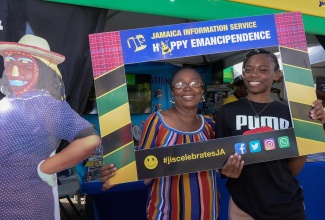 Patrons enjoy the activities at the Jamaica Information Service (JIS) booth located at Independence Village, National Indoor Sports Centre in Kingston on August 3.