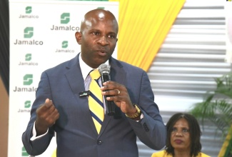 General Secretary of the Jamaica Teachers’ Association (JTA), Dr. Mark Nicely, delivers the keynote address during Jamalco’s Scholarship Awards ceremony on Tuesday (August 13) at the Wembley Centre of Excellence in Clarendon. As part of Jamalco’s Education Assistance Programme, 80 students from the parishes of Clarendon and Manchester received assistance for the upcoming school year.

