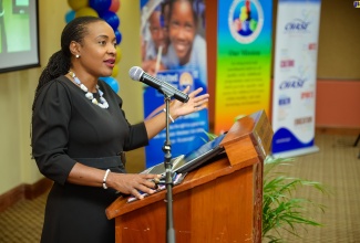 Minister of State in the Ministry of Education and Youth, Hon. Marsha Smith adresses the graduation ceremony for 100 early childhood educators who successfully completed a literacy intervention project dubbed ‘Read Right from the Start’. The graduation ceremony was held on Friday (August 23) at the University of the West Indies (UWI) Regional Headquarters, in St. Andrew.