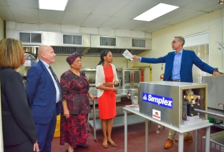 Director of the Jamaica Business Development Corporation (JBDC) Incubator and Resource Centre, David Harrison (right), leads a tour of the Agro-processing Incubator located at the centre at the grand opening in November 2023.  From left are Permanent Secretary in the Ministry of Industry, Investment and Commerce, Sancia Bennett Templer; Head of Cooperation – Delegation of the European Union, Aniceto Rodriguez Ruiz; JBDC Chief Executive Officer, Valerie Veira; and Advisor to the Vice-President of Operations, Caribbean Development Bank, Dr. Darran Newman.

