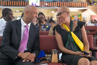 Minister of Education and Youth, Hon. Fayval Williams (right) enjoys a lively conversation with Chairman, National Council on Technical and Vocational Education and Training (NCTVET), Vaughn McDonald, at NCTVET’s 30th Anniversary Church Service held today (August 25) at the Boulevard Baptist Church in Kingston.   