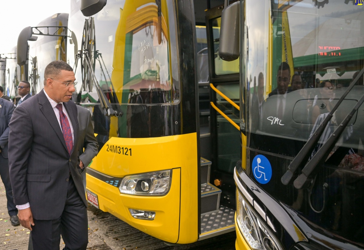 Prime Minister, the Most Hon. Andrew Holness, examines one of the new compressed natural gas (CNG) buses acquired for the Jamaica Urban Transit Company (JUTC) during Tuesday’s (August 27) handover ceremony at the State entity’s Portmore Depot in St. Catherine.

