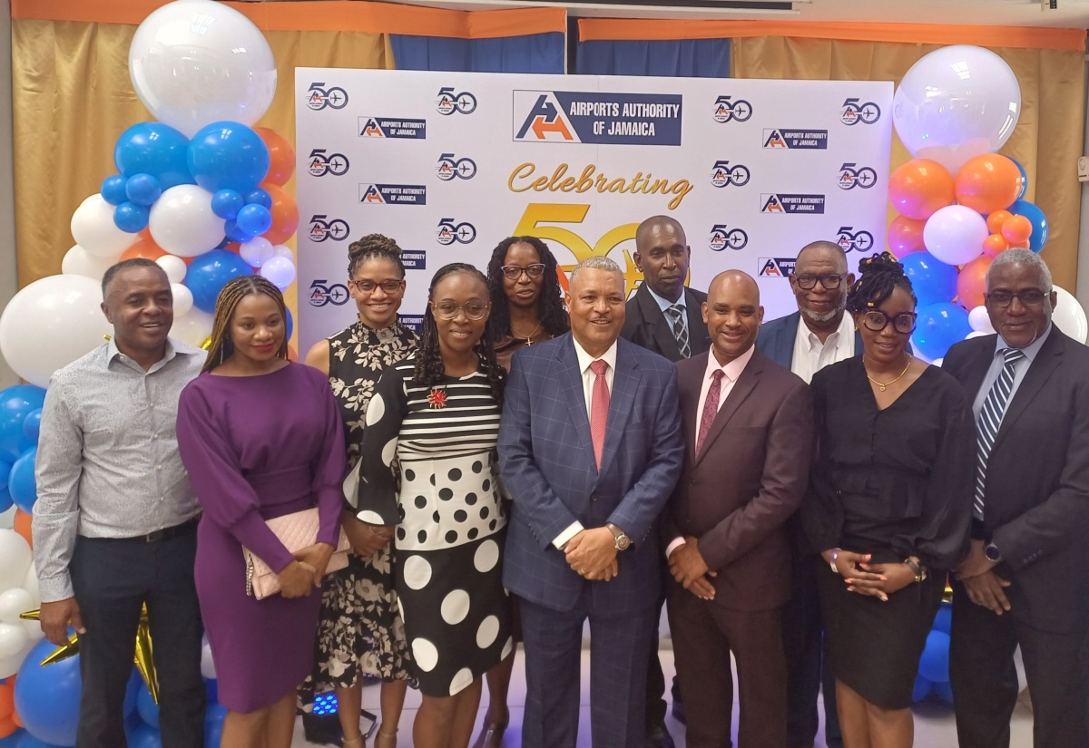 President and Chief Executive Officer, Airports Authority of Jamaica (AAJ), Audley Deidrick (centre), is joined by other members of the organisation’s management and staff during the AAJ’s 50th anniversary thanksgiving service at Webster Memorial United Church in Kingston on September 1.

