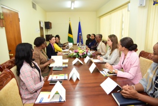 Minister of Foreign Affairs and Foreign Trade, Senator the Hon. Kamina Johnson Smith (third left), delivers remarks during a courtesy call by an Organisation of American States (OAS) delegation on the Caucus of Women Parliamentarians, at Gordon House on Friday (Sept. 13).