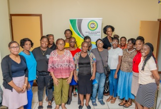 Local Economic Development Coordinator at the Social Development Commission (SDC), Tamiqua Silvera (left), with beneficiaries of the SDC business clinic, which took place on September 18 and 19 at the agency’s parish office in Kingston.