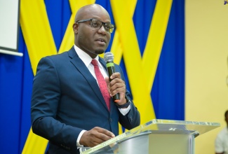 Senior Director, Information and Communications Technology, Ministry of Education and Youth, Tyrone Anderson, addresses Thursday’s (September 12) AI Web3 Pedagogy Seminar at the University of the Commonwealth Caribbean (UCC) in Kingston. He represented Portfolio Minister, Hon. Fayval Williams.

