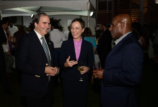 Minister of Foreign Affairs and Foreign Trade, Senator the Hon. Kamina Johnson Smith (centre), is in light conversation with Mexican Ambassador to Jamaica, His Excellency Juan Jose Gonzalez Mijares (centre) and Industry and Investment Minister, Senator the Hon. Aubyn Hill. Occasion was a reception to mark the 214th Anniversary of Mexico’s independence, hosted by the Ambassador at his official residence in Kingston on Friday (Sept. 13).