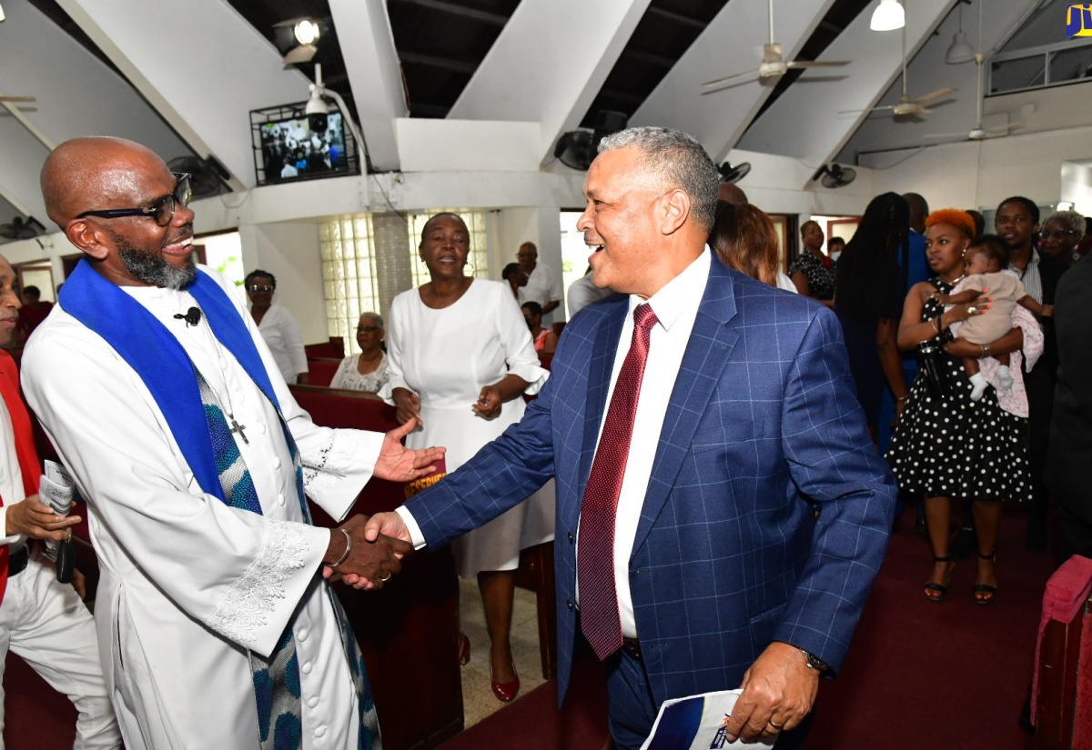 Airports Authority of Jamaica (AAJ) President and Chief Executive Officer, Audley Deidrick (right), is greeted by Pastor of Webster Memorial United Church in Kingston, Rev. Astor Carlyle, during the AAJ’s 50th anniversary commemorative service on Sunday (September 1).

