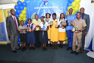 Chief Executive Officer of the Jamaica Information Service (JIS), Enthrose Campbell (fourth left); Director of Corporate Services at the JIS, Errol Gardner (left) and Director of Human Resources at the JIS, Dr. David Knight, celebrate with the JIS Heritage Competition 2023 winners representing (from left) Bright Beginnings Education Centre, Richmond Primary and Infant School, Grove Town Primary, York Castle High, José Martí High and Cornwall College.

