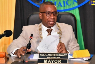 Mayor of Kingston, Councillor Andrew Swaby, addresses the recent meeting of the Kingston and St. Andrew Municipal Corporation (KSSAMC) held in the Marcus Garvey Council Chamber, downtown Kingston.

