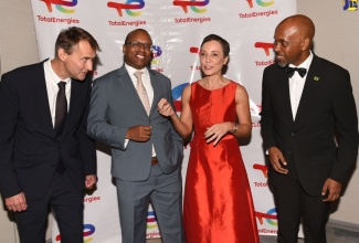 Minister of Foreign Affairs and Foreign Trade, Senator the Hon. Kamina Johnson Smith (second right), makes a point while at TotalEnergies Marketing Jamaica’s 20th Anniversary Gala, held at the AC Mariott Hotel in New Kingston, on September 5. Listening (from left) are Deputy Senior Vice President (Americas), TotalEnergies; Pierre-Emmanuel Bredin; Managing Director of Petrojam Limited, Telroy Morgan, and Chief Technical Director in the Ministry of Science, Energy, Telecommunications and Transport, Bryan Richardson.

