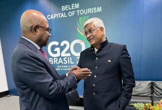 (HM G20) Minister of Tourism, Hon. Edmund Bartlett (left) engages his colleague, Minister of Tourism for India, Hon. Gajendra Singh Shekhawat in a frank discussion on ways to tap into the lucrative Indian travel market, as Jamaica seeks to diversify its markets and boost arrivals.