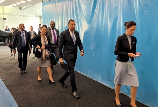 Prime Minister, Dr. the Most Hon. Andrew Holness (2nd right), arrives at the United Nations (UN) headquarters in New York this morning (Sept. 21) to address the opening of the Summit of the Future Action Day 2, which coincides with International Day of Peace. He is accompanied by Minister of Foreign Affairs and Foreign Trade, Senator the Hon. Kamina Johnson Smith (third right). Action Day 2 focusses on three priority themes: A Digital Future for All; A Peaceful Future for All; and A Sustainable Future for All.  The Action Days, from September 20 to 21, bring together representatives from Member States, civil society, private sector, academia, local and regional authorities, youth, and many more, for broad engagement and inclusion. Prime Minister Holness is participating in the 79th United Nations General Assembly (UNGA) under the theme: ‘Unity in Diversity: for the advancement of peace, sustainable development, and human dignity for everyone.’