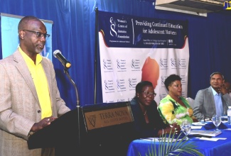 Permanent Secretary in the Ministry of Culture, Gender, Entertainment and Sport, Densil Thorpe (left), addresses the launching ceremony for the Women’s Centre of Jamaica Foundation (WCJF) Empowered Futures Parenting Curriculum, at the Terra Nova All-Suite Hotel in St. Andrew on Thursday (September 12). Listening (from second left) are WCJF Executive Director, Novlette Howell, and Chair, Debby-Ann Brown Salmon; and Deputy Representative, UNICEF Jamaica, Mohammad Mohiuddin.