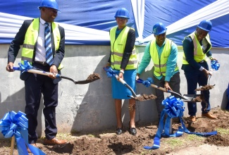 Education and Youth Minister, Hon. Fayval Williams (second left), breaks ground for the construction of the Overseas Examinations Commission (OEC) new state-of-the-art multipurpose facility, on Wednesday (September 18), at the Commission's Manhattan Road location in Kingston. Also taking part (from left) are Chairman of the OEC, Brian Bennett-Easy; Executive Director of the OEC, Hector Stephenson; and Mayor of Kingston, and Councillor for the Vineyard Town Division, Andrew Swaby.

