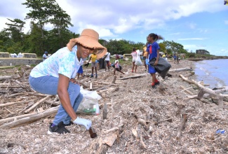 Teacher at Robin’s Bay Primary School in St. Mary, Judith Stubbs, participates in a clean-up of Robin’s Bay Beach on September 12.