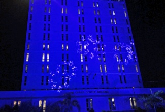 The Office Centre Building, which houses the corporate offices of the  Maritime Authority of Jamaica (MAJ), illuminated with blue lights on World Maritime Day (WMD) 2023.

