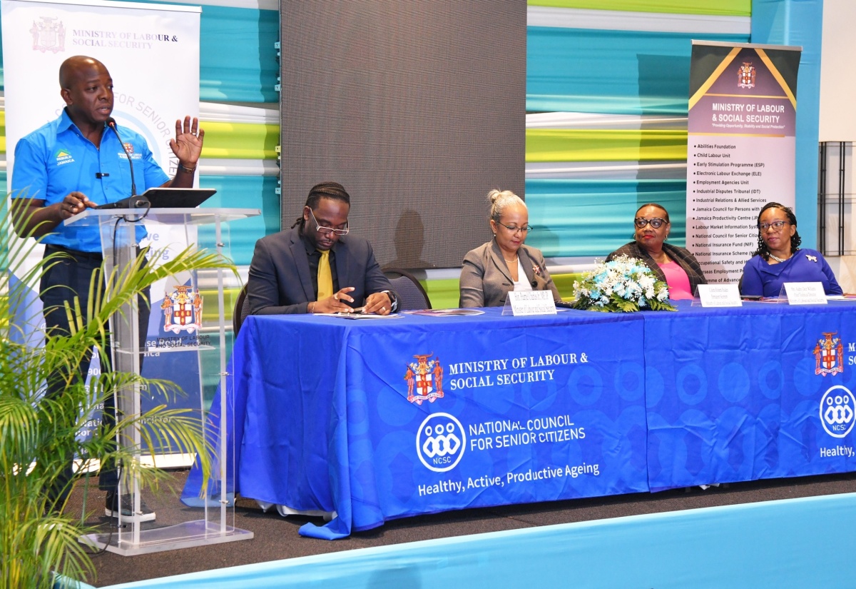 Minister of Labour and Social Security, Hon. Pearnel Charles Jr. (left), addresses the launch of Senior Citizens Month on Wednesday (September 4), at The Jamaica Pegasus hotel in New Kingston. Listening  (from left) are Chairperson, Andre Miller; Permanent Secretary in the Ministry, Collette Roberts Risden; Chief Technical Director, Audrey Deer-Williams; and National Council for Senior Citizens Board Chair, Julian McKoy Davis. 

