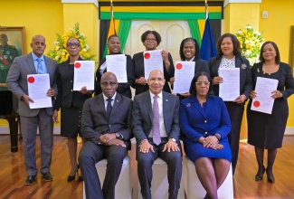 Governor-General, His Excellency the Most Hon. Sir Patrick Allen (seated centre); Chief Justice, Hon. Bryan Sykes (seated left); and President of the Court of Appeal, Hon Justice Marva McDonald Bishop (seated right), with members of the judiciary who were sworn in to higher offices at today’s (September 16) swearing in ceremony, at King’s House. They are from (left) Justice Kissock Laing;  Her Honour Tracey-Ann Johnson; Her Honour Opal Smith; Justice Georgiana Fraser; Ms. Andrea Martin Swaby; Her Honour Christine McNeil and Ms. Maxine Jackson.

