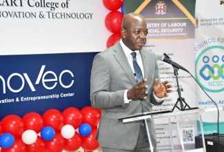 Minister of Labour and Social Security, Hon. Pearnel Charles Jr., addresses the graduation ceremony for the National Council for Senior Citizens (NCSC) Digital Literacy training programme, which was held at the HEART College of Innovation and Technology in St. James, recently.

