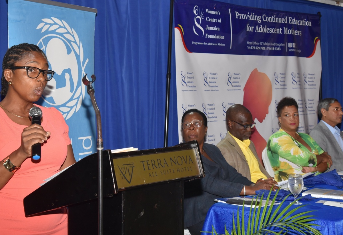 Projects Coordinator, Women’s Centre of Jamaica Foundation (WCJF), Natalie Fuller, provides an overview on the Empowered Futures Parenting Curriculum during the recent launch at the Terra Nova All-Suite Hotel in St. Andrew. Listening (from left) are WCJF Executive Director, Novelette Howell; Permanent Secretary in the Ministry of Culture, Gender, Entertainment and Sport, Denzil Thorpe; WCJF Chair, Debby-Ann Brown Salmon; Deputy Representative, UNICEF Jamaica, Mohammad Mohiuddin; and Senior Lecturer in Caribbean Institute for Health Research (CAIHR) at the University of the West Indies (UWI), Mona, Epidemiology Research Unit, Dr. Christine Powell. The curriculum is designed to support adolescent mothers across Jamaica by equipping them with the tools and knowledge to raise happy, healthy children and promote positive parenting practices.

