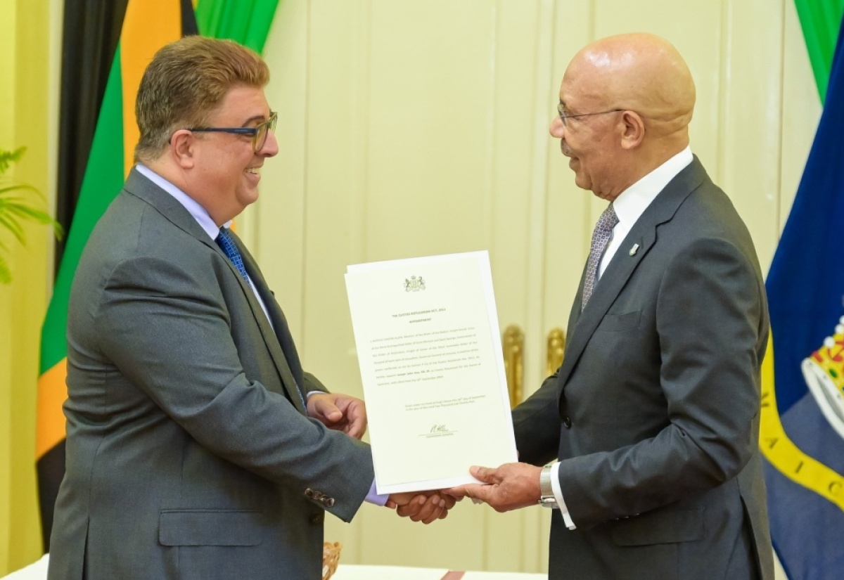 Governor General, His Excellency the Most Hon. Sir Patrick Allen (right), presents the Instrument of Office to the new Custos of St. Ann, Joseph Issa, at a recent swearing-in ceremony at King’s House in St. Andrew.

